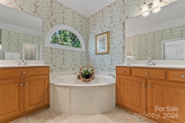 bathroom with vanity, a tub to relax in, and tile patterned flooring