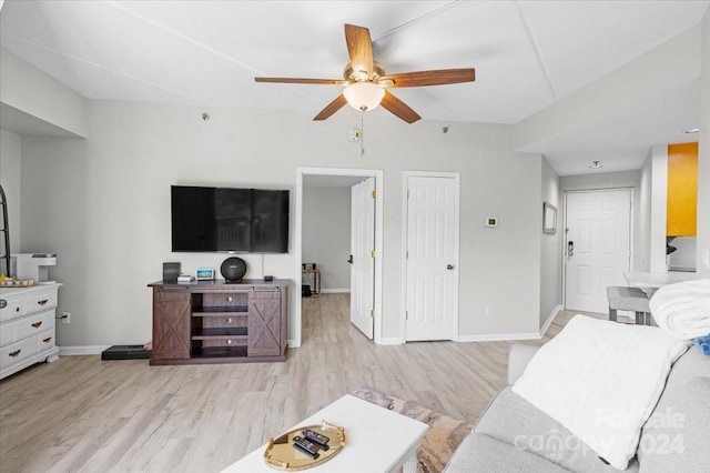 living room featuring light hardwood / wood-style flooring and ceiling fan