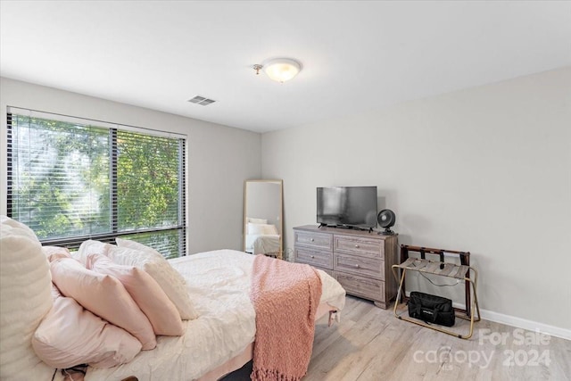 bedroom with light hardwood / wood-style flooring