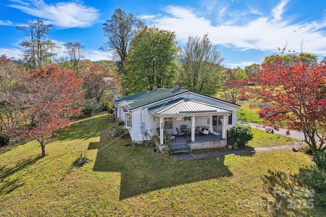 396 Will Hyatt Rd, Waynesville, NC 28786 - rear view of house with a lawn, a chimney, and a metal roof