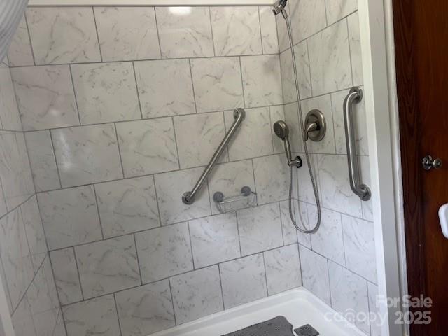 396 Will Hyatt Rd, Waynesville, NC 28786 - bathroom featuring tiled shower