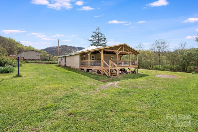 back of property featuring a lawn