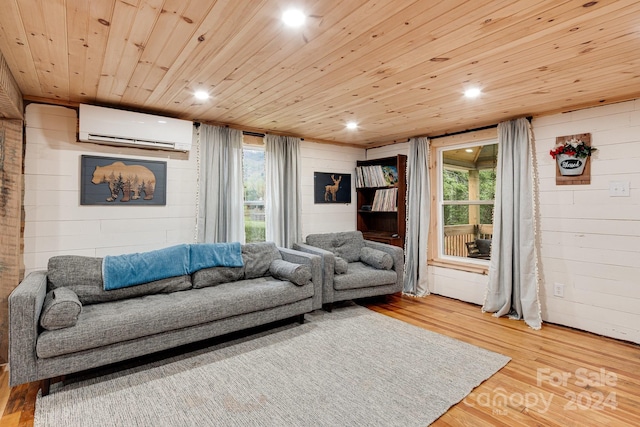 living room featuring an AC wall unit, hardwood / wood-style flooring, and wood ceiling