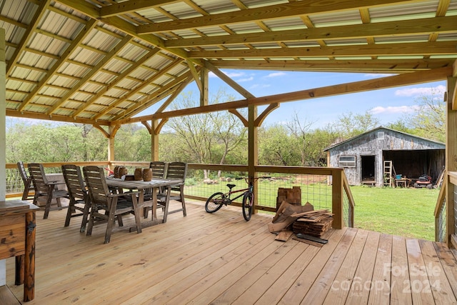 wooden terrace with a yard