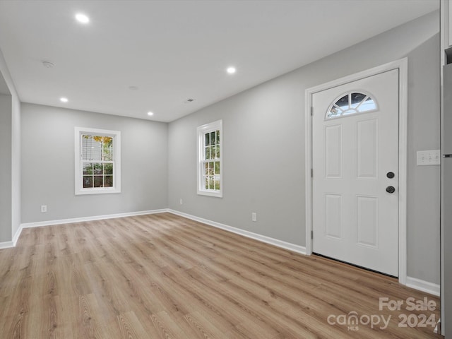 entryway with light hardwood / wood-style floors