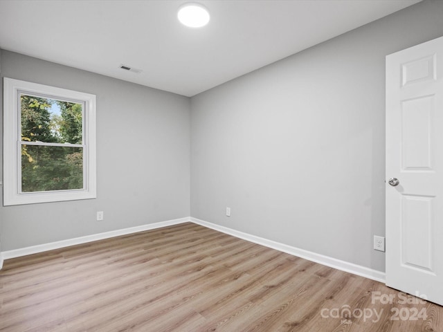 empty room with light hardwood / wood-style floors