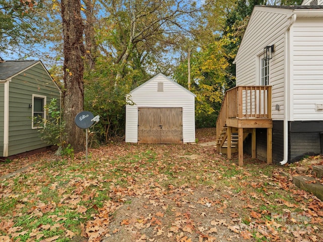 view of yard with a deck and a shed