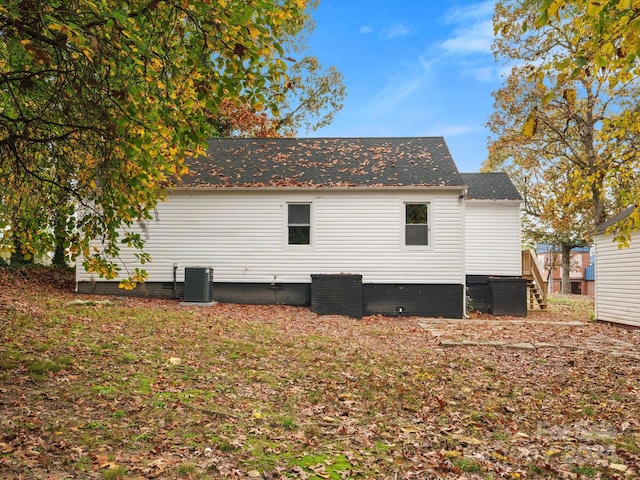 view of side of property with cooling unit