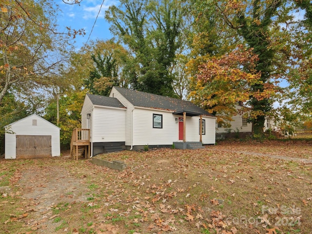 view of front of house with a storage unit