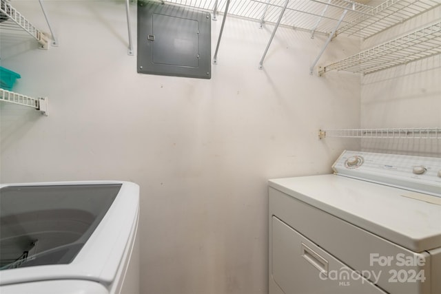 laundry area featuring independent washer and dryer and electric panel