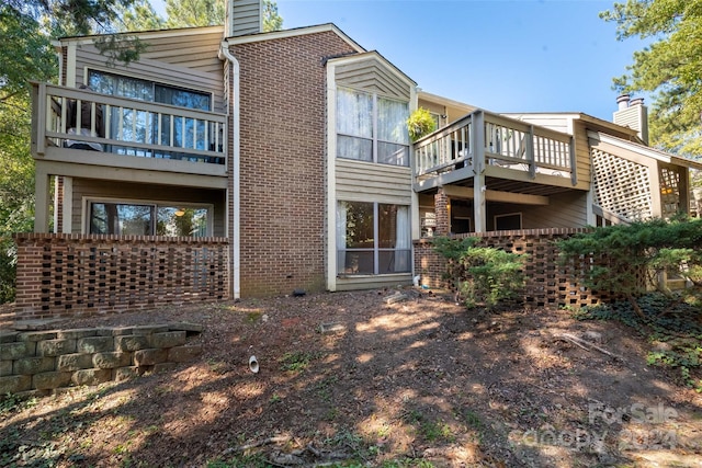 back of house with a balcony