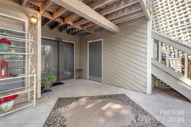 doorway to property featuring a patio