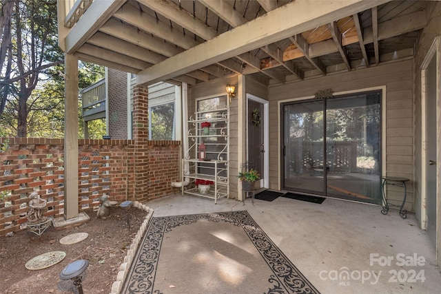 property entrance with a patio