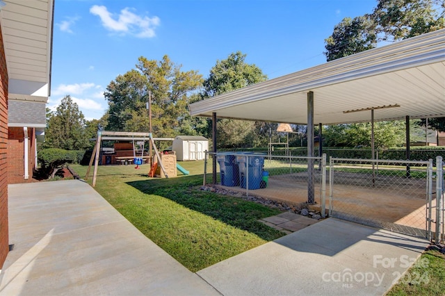 view of yard featuring a playground and a storage shed