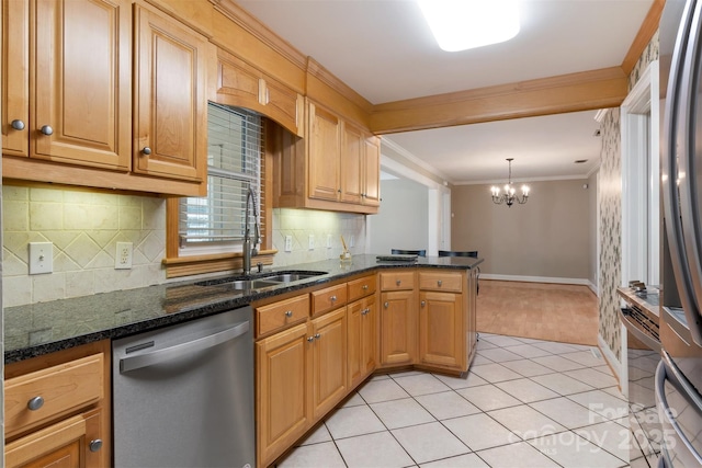 kitchen featuring pendant lighting, crown molding, appliances with stainless steel finishes, light tile patterned flooring, and dark stone countertops