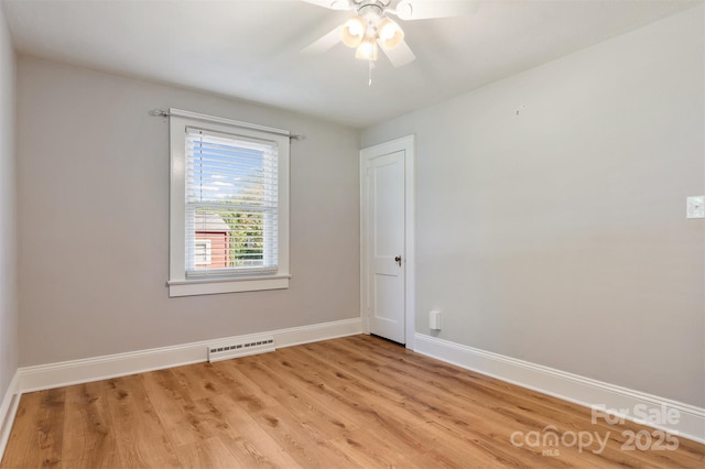 empty room with baseboards, visible vents, light wood-style flooring, and a ceiling fan