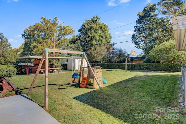 view of jungle gym with a fenced backyard and a yard