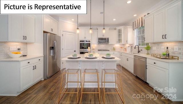 kitchen with tasteful backsplash, a center island, white cabinets, dark wood finished floors, and stainless steel appliances
