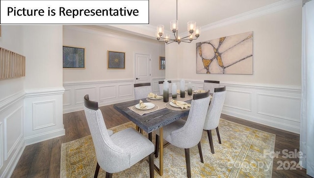 dining area featuring an inviting chandelier, ornamental molding, a wainscoted wall, a decorative wall, and wood finished floors