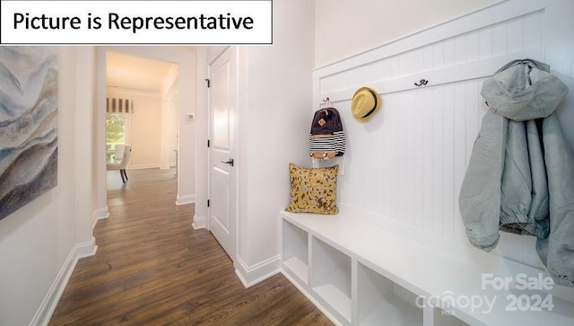 mudroom featuring baseboards and dark wood finished floors