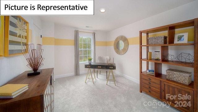 office featuring light carpet and baseboards