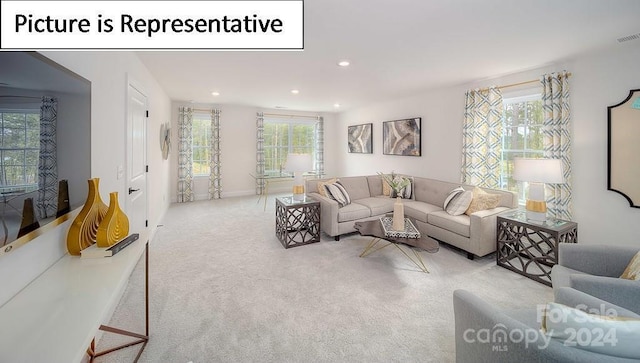 living area with carpet floors, baseboards, recessed lighting, and visible vents