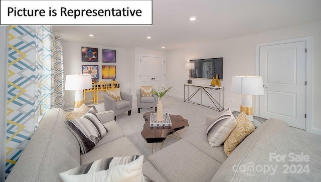 living room featuring recessed lighting, baseboards, and carpet floors