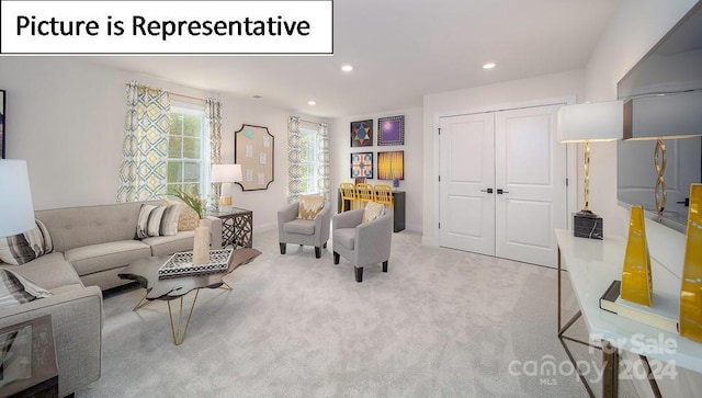 carpeted living room with recessed lighting