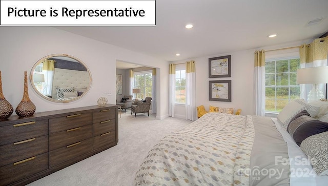 bedroom with visible vents, recessed lighting, and light colored carpet