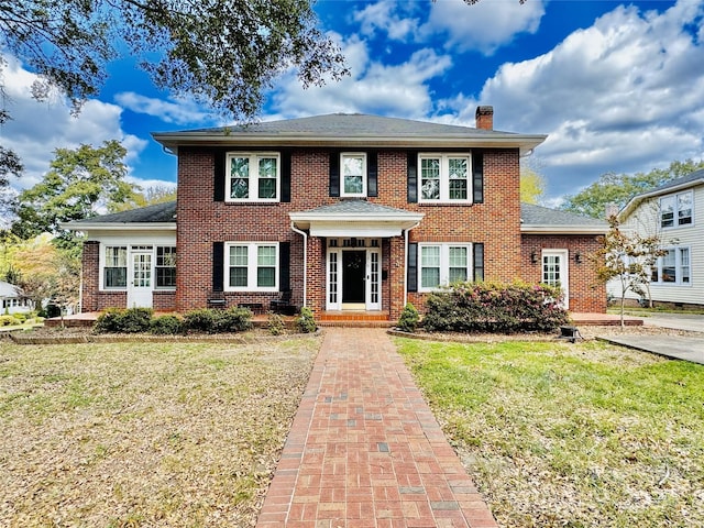 view of front of home with a front lawn