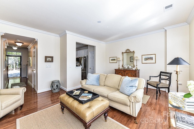 living room featuring hardwood / wood-style floors and ornamental molding