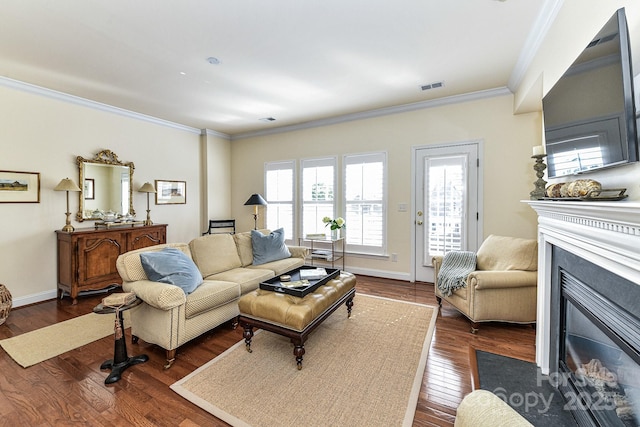 living room featuring dark hardwood / wood-style flooring and crown molding