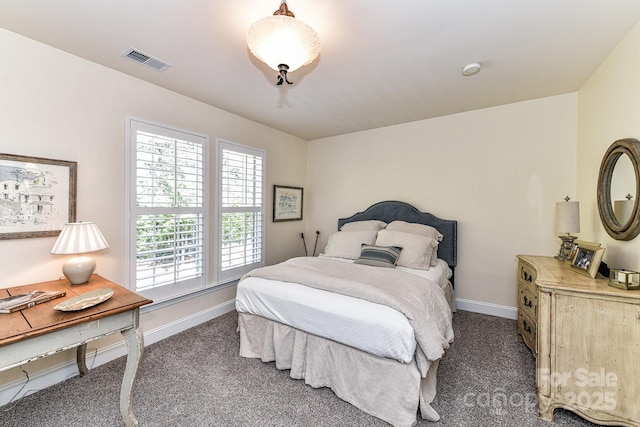 bedroom featuring dark colored carpet