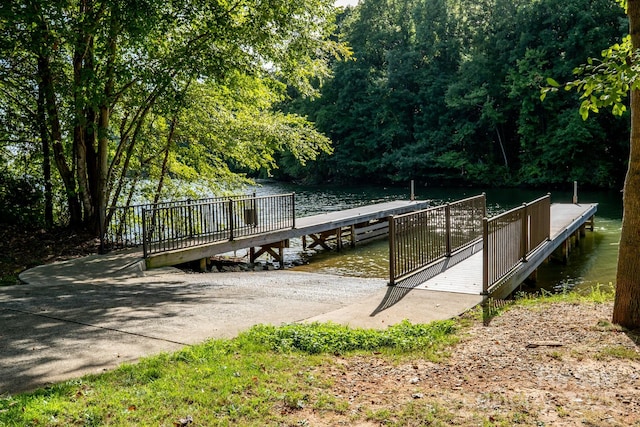 dock area featuring a water view