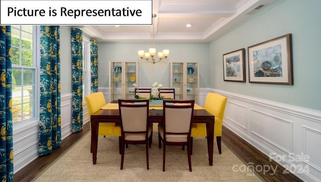 dining area with beamed ceiling, ornamental molding, a chandelier, wood finished floors, and coffered ceiling