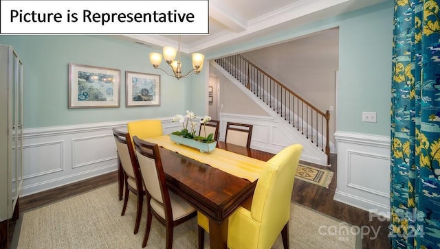 dining room featuring crown molding, dark wood-type flooring, a wainscoted wall, a chandelier, and stairway
