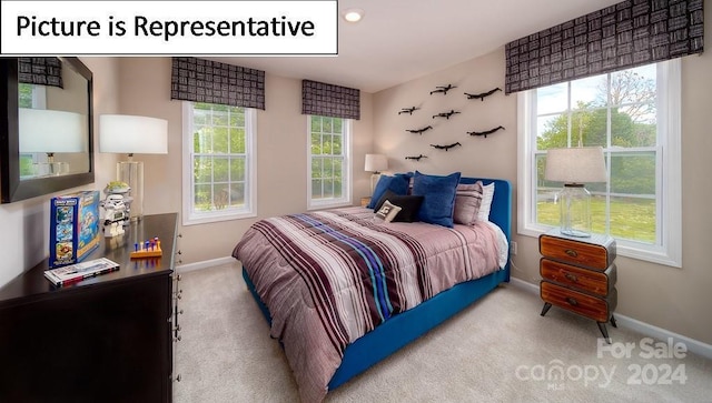 bedroom with carpet flooring and baseboards