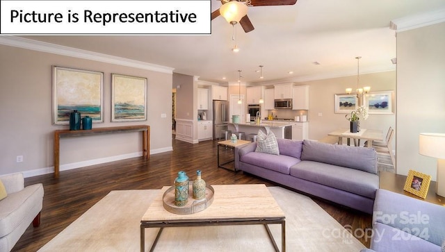 living area with dark wood-type flooring, ornamental molding, baseboards, and ceiling fan with notable chandelier