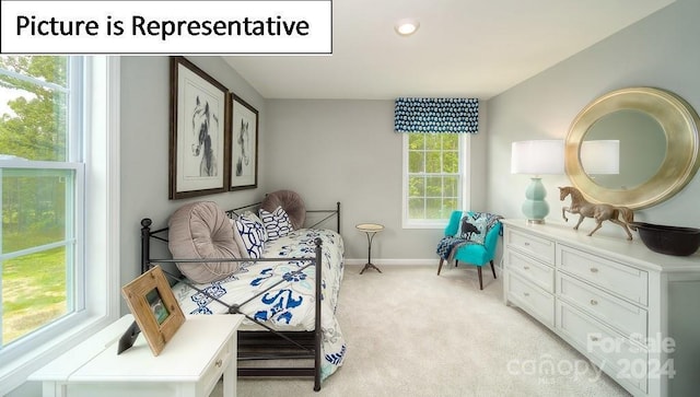 living area featuring baseboards, recessed lighting, and light carpet