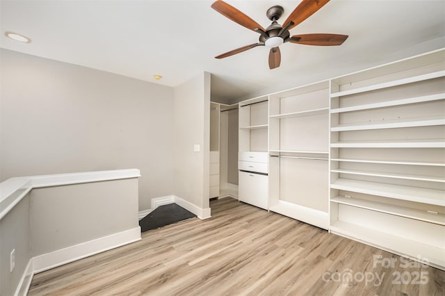 unfurnished bedroom with ceiling fan and light hardwood / wood-style flooring