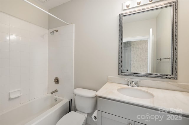 full bathroom with vanity, toilet, and tiled shower / bath