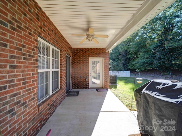 view of patio with ceiling fan and central AC