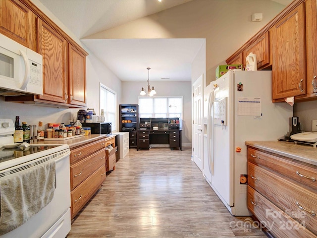 kitchen with white appliances, light hardwood / wood-style floors, lofted ceiling, decorative light fixtures, and a notable chandelier