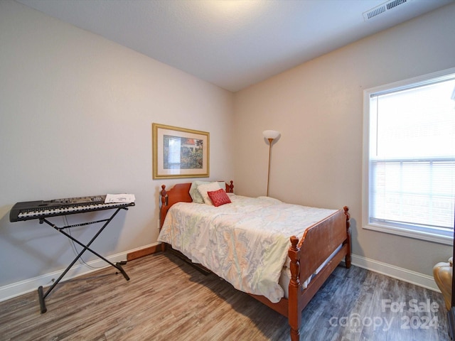 bedroom featuring hardwood / wood-style floors