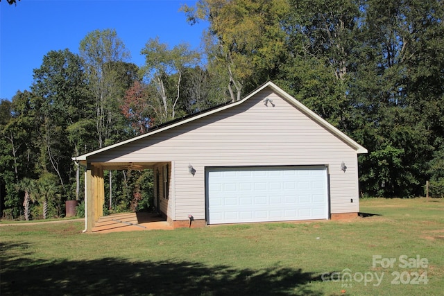 garage featuring a lawn