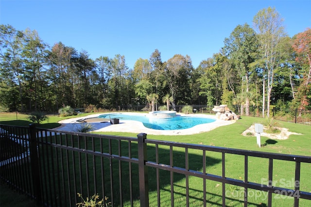 view of pool featuring a yard, an in ground hot tub, and a patio area