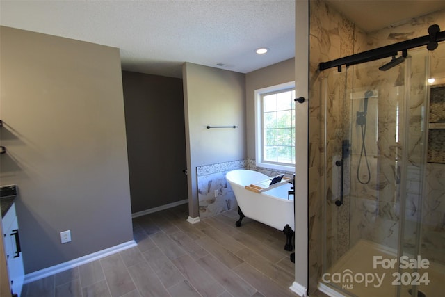 bathroom featuring vanity and plus walk in shower