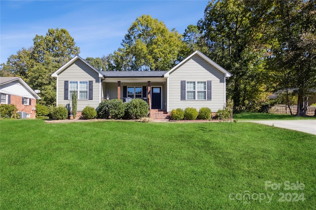 ranch-style house with a front yard