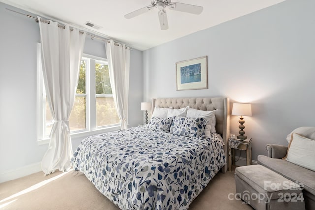 carpeted bedroom featuring ceiling fan