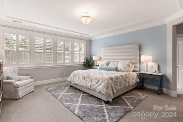 carpeted bedroom with ornamental molding